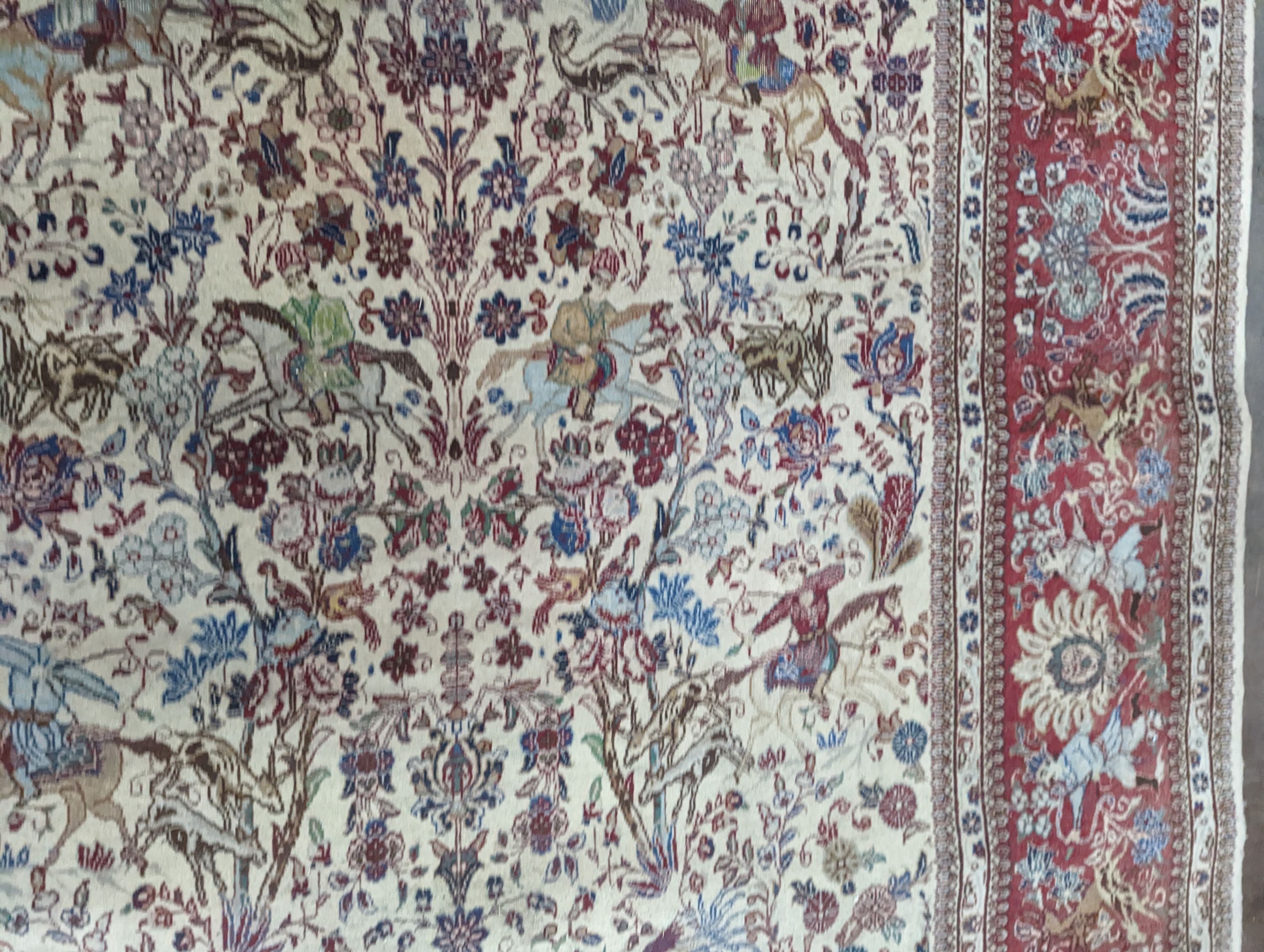 A Tabriz ivory ground pictorial rug (signed), 390 x 294cm